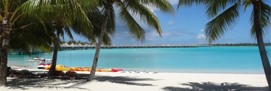 The beautiful beach at the St. Regis in Bora Bora.  Overwater bungalows are the signature of Tahiti.